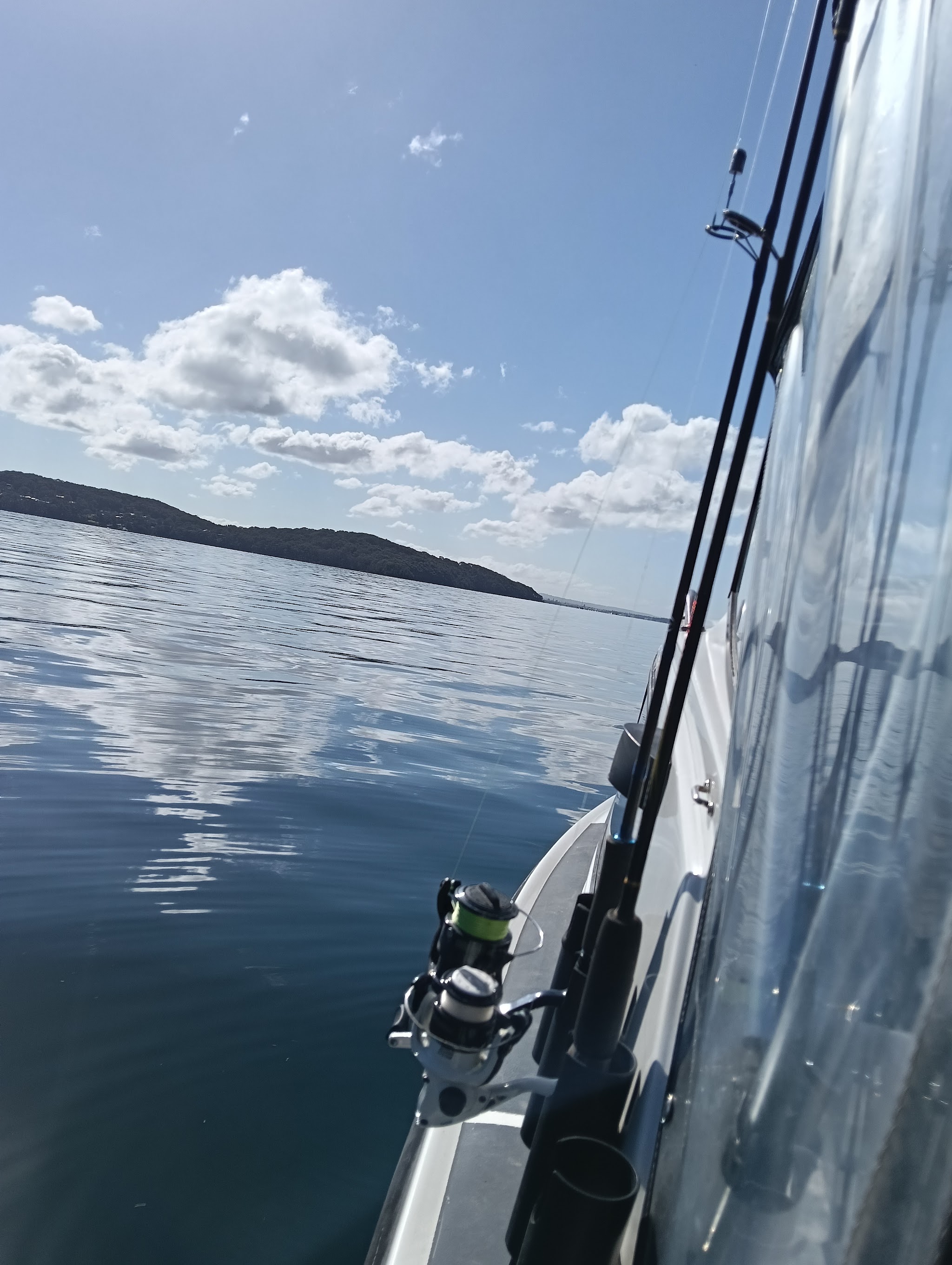 A rod out over flat water on a clear morning, taken by a customer