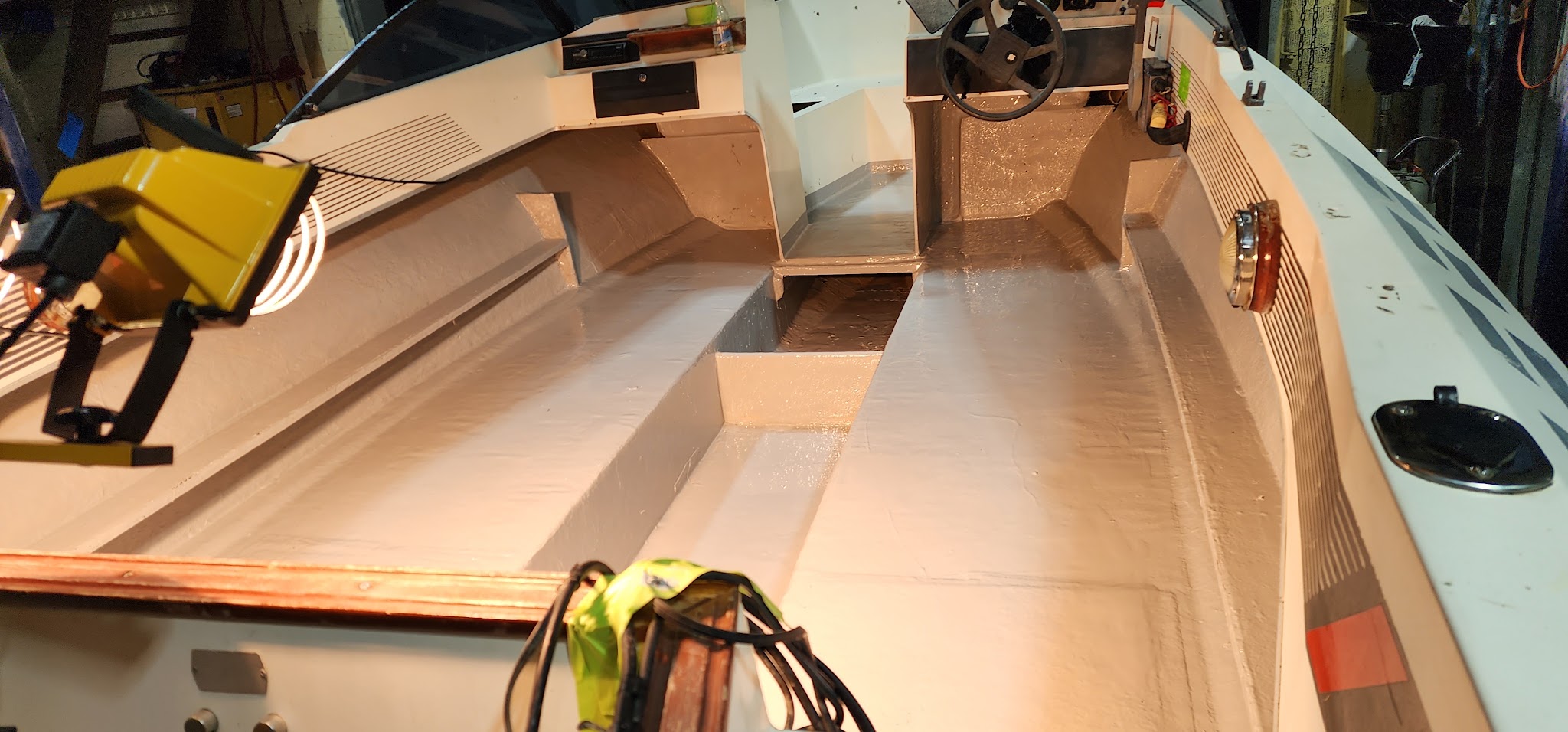 Bare hull interior part way through a refit, with the wiring run in